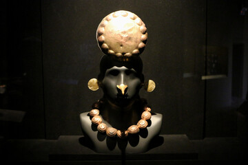 gold art piece display in museum, Peru