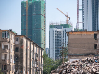 Old  Khrushchyovka residential apartments being demolished, while new buildings are under...
