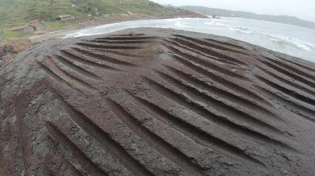 Lithic workshop, rocks used by prehistoric men to polish and produce stone tools, archaeological site in Praia do Rosa - Imbituba, Santa Catarina, Brazil