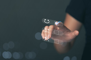 Business people touching the virtual screen on the happy Smile face icon to give satisfaction in...