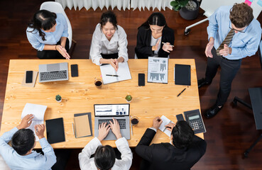 Panorama top view diverse group of business analyst team analyzing financial data report paper on...