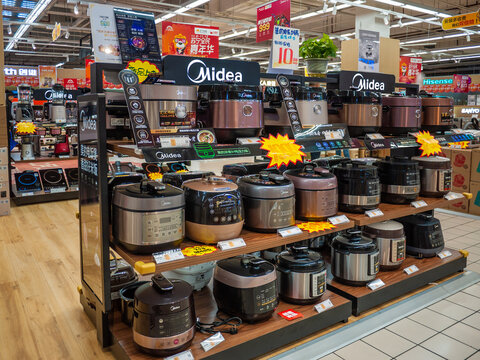 A variety of Midea rice cookers with many functions is displayed in the store in China for customers to choose from. Midea Group is a Chinese electrical appliance manufacturer.