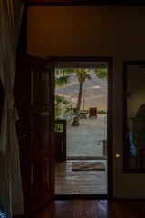 looking through doorway chair beach umbrella