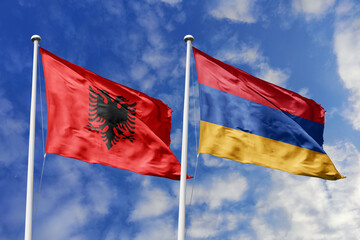 3d illustration. Albania and Armenia Flag waving in sky. High detailed waving flag. 3D render. Waving in sky. Flags fluttered in the cloudy sky.