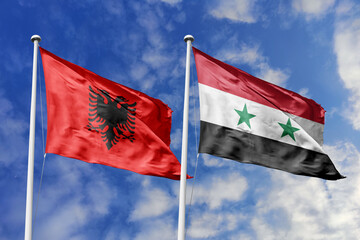 3d illustration. Albania and Syria Flag waving in sky. High detailed waving flag. 3D render. Waving in sky. Flags fluttered in the cloudy sky.