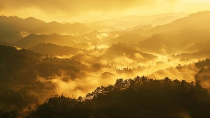 Fototapeta premium A golden sunrise breaking through misty mountains, casting a serene glow over the landscape