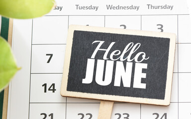 Hello June word on a small chalk board.