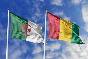 3d illustration. Algeria and Guinea Flag waving in sky. High detailed waving flag. 3D render. Waving in sky. Flags fluttered in the cloudy sky.