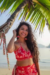 A indian woman in summer outfits on a tropical island