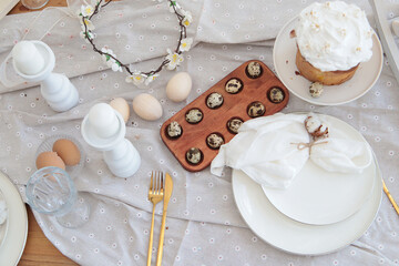 Easter table. Quail eggs. Kulich. Close-up. Selective focus. Copyspace