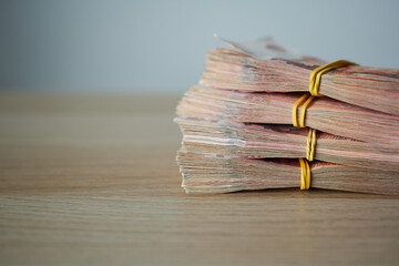 Stack of banknotes on the table, shallow depth of field.
