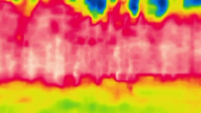 A irregular flicker of red and blue spots. Abstract dynamic picture, how to scroll a damaged film.Image from thermal imager device.