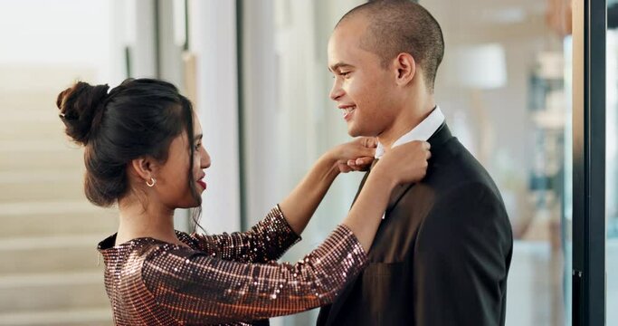 Couple, suit and tie with kiss for love, date and passion at home with smile, romance and valentines day event. Lover, woman and man in luxury house with support for anniversary or relationship