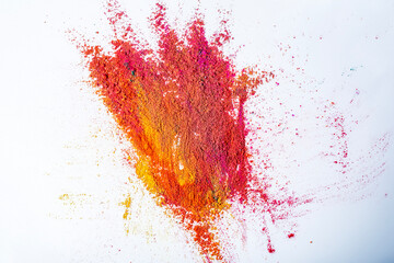 Colorful holi powder explosion on white background.