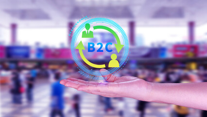 B2C, Business to customer marketing strategy concept. Businessman holding with virtual B2C icon for business strategy, communication, feedback, online marketing, Ecommerce marketing strategy.