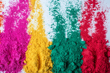 Colorful holi powder isolated on white background, top view.