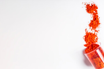 Colorful Red holi powder in a glass isolated on white background