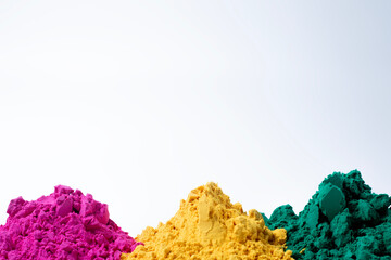 Colorful holi powder isolated on white background with copy space.