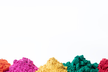 Colorful holi powder isolated on white background with copy space.