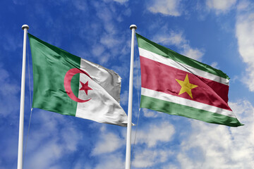 3d illustration. Algeria and  Suriname Flag waving in sky. High detailed waving flag. 3D render. Waving in sky. Flags fluttered in the cloudy sky.