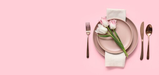 Beautiful table setting with tulip flowers on pink background with space for text