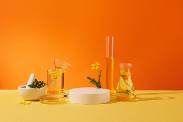An empty podium for display product, lab glassware filled with transparent liquid and fresh...