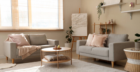 Light living room with grey sofas and coffee table