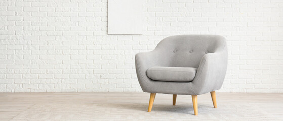 Minimalist interior with grey armchair