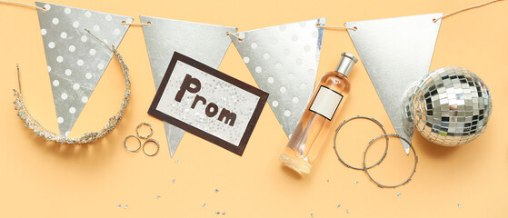 Word PROM with tiara, disco ball and perfume bottle on beige background © Pixel-Shot