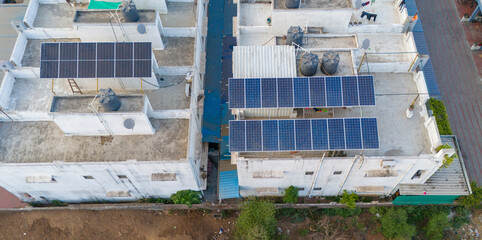 Top view of Solar panel system on the terrace in Indian City. Domestic use of Solar Electricity system System. © Grower