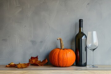 Still life scene featuring an orange pumpkin and a black wine bottle, suitable for culinary articles and fall decor ideas.and Halloween decorations, cards..pumpkin and wine bottle on plain background - obrazy, fototapety, plakaty