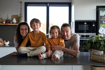 Happy family portrait in the kitchen. Healthy family lifestyle.