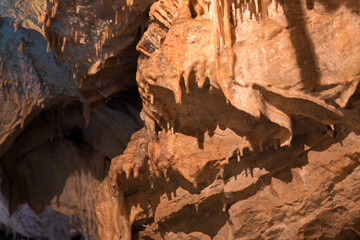 Inside limestone cave - different morphological elements created by driping or flowing water and...