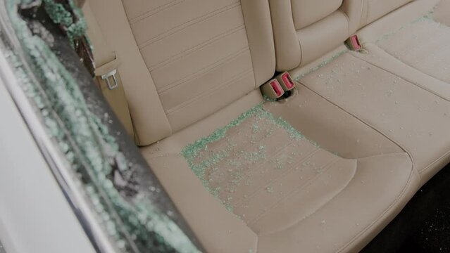 Glass shattered thief wasted no time in ransacking car for valuables, perpetrating flagrant act property theft. This breach of security serves as stark reminder of prevalence of crime.