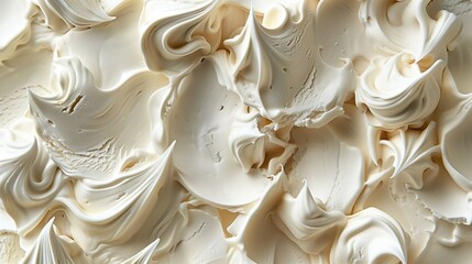 Close-up view of whipped cream texture with soft peaks and swirls