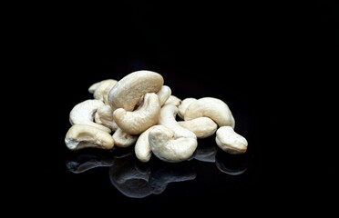 Cashew Nut Heap Isolated on Black Background with Copy Space