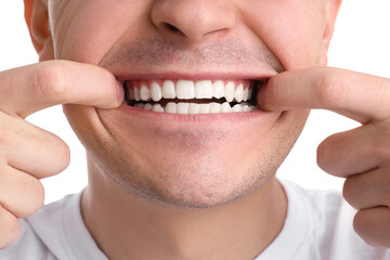 Young man with healthy teeth isolated on white background, closeup