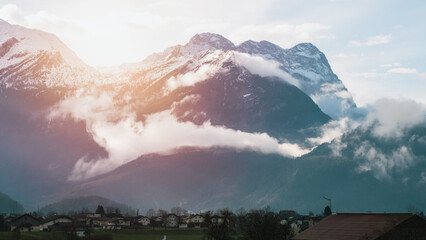 Tranquil Beauty: Cloud-Enshrouded Peaks in the Heart of the Alps