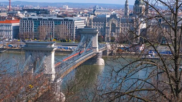 Secheni bridge landmark. A nice sunny Budapest landmark with Danube river with Secheni bridge and buildings on the bank in the sun light.