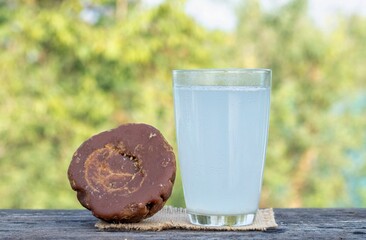 Date Palm Tree Juice in a Glass or  Date Palm Jaggery Isolated on Wooden Table with Copy Space