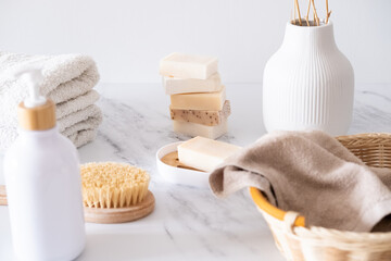 Bath accessories and skin care in a light bathroom interior