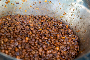a bowl full of roasted coffee beans