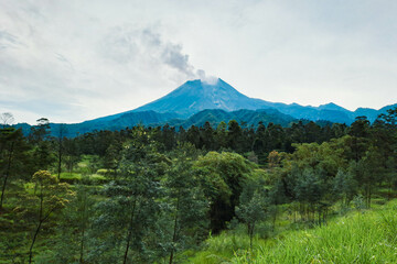 Mount Merapi in Indonesia in the afternoon is very clear and majestic against a background of blue...