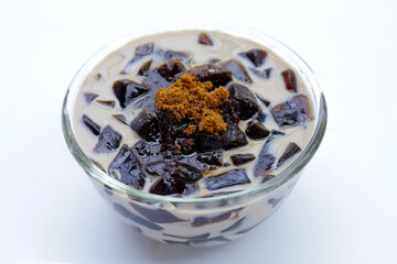 Grass jelly in milk with brown sugar, herbal dessert. Mesona chinensis