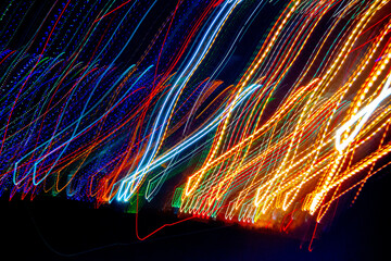Abstract blurry background with pattern from colorful traces or trajectory of lights