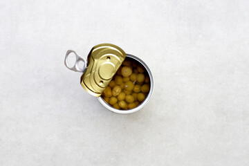 Canned green peas on white background.
