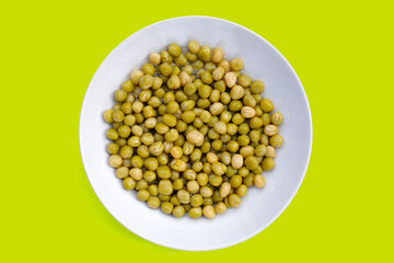 Canned green peas on white background.