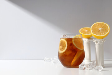 A glass of cold tea with fresh orange slices