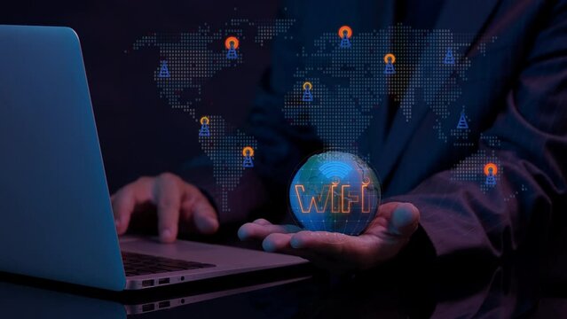 Wireless networking digital futuristic technology innovation. Business communication social network concept. Businessman holding earth model to show animation of Wifi internet network symbol icon.