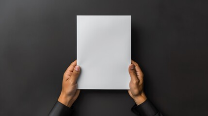 A Blank White Flyer Mockup in Man's Hand with a Elegant Black Background : Suitable for Be Used to Showcase Flyer, Poster, Resume or Letterhead.
